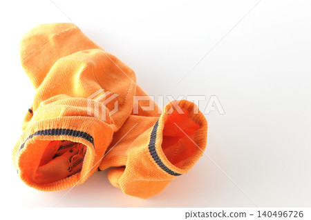 Socks left lying around photographed against a white background. Socks left lying around photographed against a white background. 140496726