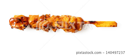 A single skewer of grilled chicken with sauce, isolated against a white background, with a shadow, horizontal orientation, cutout image. 140497237
