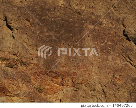 Brown, uneven stone; copy space; cliff art; enjoy the texture. Brown, uneven stone; copy space; cliff art; enjoy the texture. 140497263