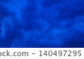 Dark blue rainy sky with falling raindrops texture for weather photography background design 140497295