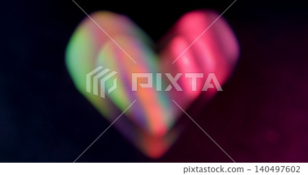 Heart stripes. Blur love geometric. Defocused green neon purple color shine lens flare glare flicker sparkle gleam on abstract dark black background. Heart stripes. Blur love geometric. Defocused green neon purple color shine lens flare glare flicker sparkle gleam on abstract dark black background. 140497602