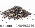 A pile of black sesame seeds on a white background – a healthy food rich in sesamin. 140498849