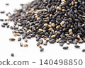 A pile of black sesame seeds on a white background – a healthy food rich in sesamin. 140498850