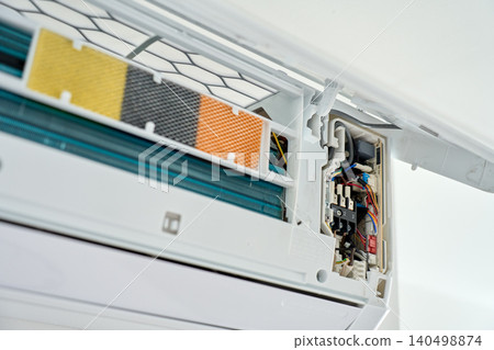 Open wall air conditioner showing filters and wiring Open wall air conditioner showing filters and wiring 140498874