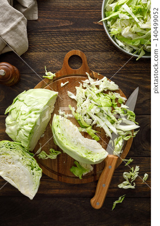 Cabbage cut and shredded. Fresh raw white chopped Cabbage Cabbage cut and shredded. Fresh raw white chopped Cabbage 140499052