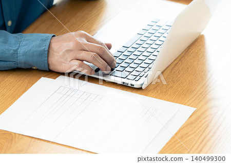 Hand of a man working on a computer Hand of a man working on a computer 140499300