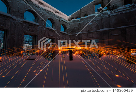 Fire painting at winter at night in abandoned place Fire painting at winter at night in abandoned place 140500439