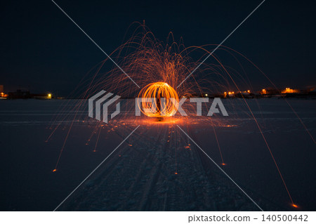 Fire painting at winter at night in abandoned place Fire painting at winter at night in abandoned place 140500442