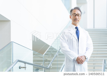 Senior doctor in a white coat Senior doctor in a white coat 140500511