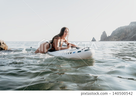 Woman Paddleboarding Ocean Coastline, Paddleboarding Adventure, Water Sports Woman Paddleboarding Ocean Coastline, Paddleboarding Adventure, Water Sports 140500542