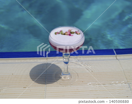 delicious cocktail by the pool delicious cocktail by the pool 140500880