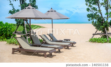 Beach chairs or loungers under the umbrellas on tropical beach Beach chairs or loungers under the umbrellas on tropical beach 140501138