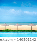 Luxury swimming pool with beach umbrella and sea landscape ahead 140501142