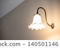 Vintage bell wall lamp with illuminated light bulb 140501146