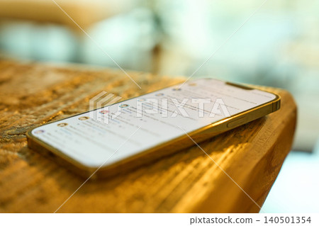 A smartphone displaying the SNS screen. A smartphone displaying the SNS screen. 140501354
