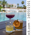 colorful and delicious cocktails in a hotel pool 140501501