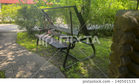 Landscape design of a park area. Swings, plants, stone paths Landscape design of a park area. Swings, plants, stone paths 140501535
