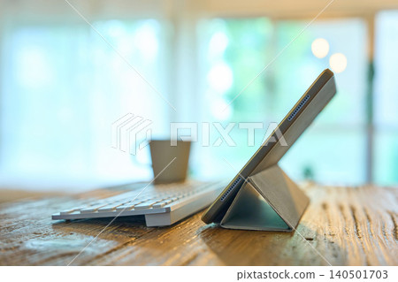 Tablet PC placed on the table in the room Tablet PC placed on the table in the room 140501703
