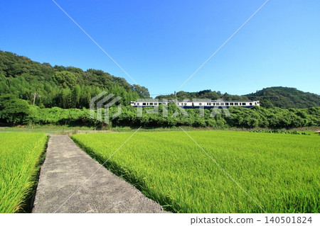A sightseeing train travels through the countryside in early autumn. A sightseeing train travels through the countryside in early autumn. 140501824