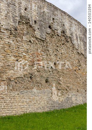 Wall of Izborsk Fortress is under cloudy sky, Pskov Oblast, Russia Wall of Izborsk Fortress is under cloudy sky, Pskov Oblast, Russia 140501894