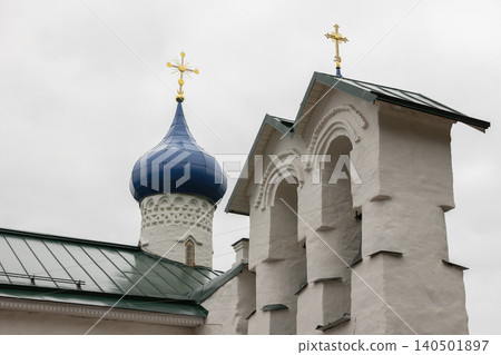 Photograph of a Russian Orthodox church featuring a blue onion dome. Pechory Photograph of a Russian Orthodox church featuring a blue onion dome. Pechory 140501897