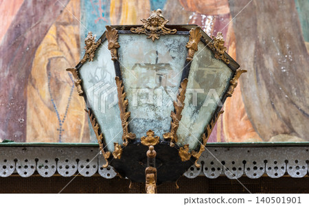 Antique ornate street lamp featuring weathered stained glass panels Antique ornate street lamp featuring weathered stained glass panels 140501901