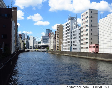 A view of the Nihonbashi River and the city skyline from Toyomi Bridge in Chuo Ward, Tokyo. A view of the Nihonbashi River and the city skyline from Toyomi Bridge in Chuo Ward, Tokyo. 140501921