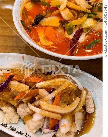 Spicy and flavorful jjampong with seafood and chewy noodles, paired with crispy tangsuyuk coated in sweet and sour sauce. A perfect balance of bold spice and tangy crunch for a satisfying meal. 140502548