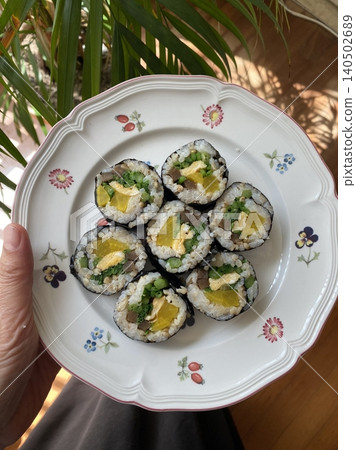 Delicious kimbap rolls filled with fresh vegetables, seasoned rice, and savory proteins, all wrapped in crisp seaweed. A perfect combination of flavor and texture in every bite. Delicious kimbap rolls filled with fresh vegetables, seasoned rice, and savory proteins, all wrapped in crisp seaweed. A perfect combination of flavor and texture in every bite. 140502689