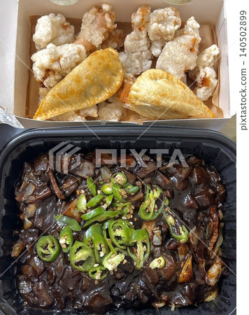 A classic Korean-Chinese combo of jajangmyeon with thick, chewy noodles coated in rich black bean sauce, served alongside crispy tangsuyuk, deep-fried pork with sweet and sour sauce. 140502899