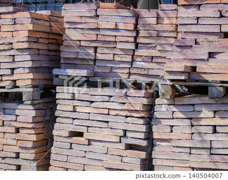 A Stacked Collection of Lightly-Colored Building Bricks Arranged Neatly for Construction Projects and Architectural Needs A Stacked Collection of Lightly-Colored Building Bricks Arranged Neatly for Construction Projects and Architectural Needs 140504007