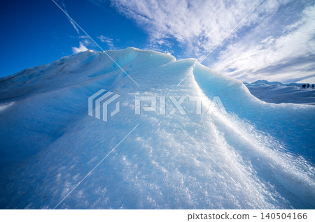 Perito moreno glaciers blue ice ridge under bright sky across frozen landscape in Patagonia national park 140504166