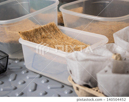 raw rice in plastic container raw rice in plastic container 140504452