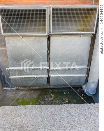 Exploring a Series of Damp Metal Grates Overlooking a Stagnant Green Pool Surrounded by Urban Walls and Infrastructure Exploring a Series of Damp Metal Grates Overlooking a Stagnant Green Pool Surrounded by Urban Walls and Infrastructure 140504495