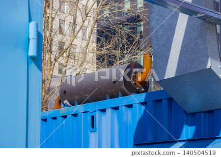 Industrial Equipment and Utility Infrastructure: A Detailed View of Pipework and Container Elements in an Urban Environment Industrial Equipment and Utility Infrastructure: A Detailed View of Pipework and Container Elements in an Urban Environment 140504519