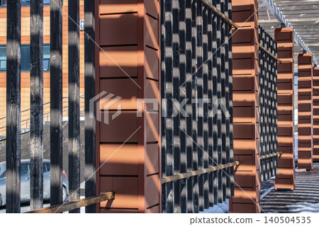 A Geometric Perspective on Architectural Structures Highlighted by Striking Shadows and Light Play, Showcasing the Interplay of Materials and Design 140504535