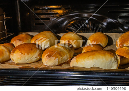 Freshly Baked Golden Brown Rolls in Oven, Delicious Artisan Bread Loaves Ready for Serve Freshly Baked Golden Brown Rolls in Oven, Delicious Artisan Bread Loaves Ready for Serve 140504698