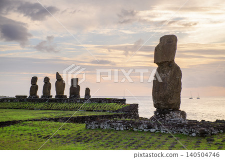 Solemn serene moai statue standing on easter island chile at sunset Solemn serene moai statue standing on easter island chile at sunset 140504746