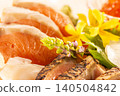 Sashimi of salmon with a vibrant cross-section from a seared surface, and raw salmon. Assortment of white fish. 140504842