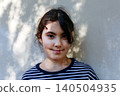 Smiling Preteen Girl Looking at Camera in Natural Outdoor Light 140504935