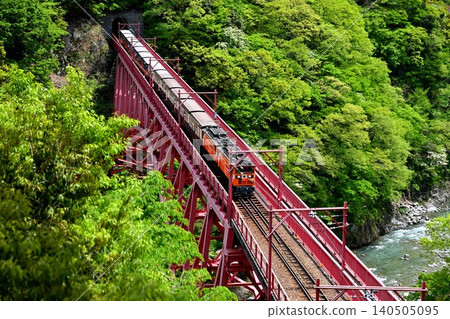 Truck train crossing Shinyamabiko Bridge 140505095