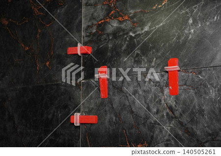 Close-Up View of Tile Spacers Used in Home Improvement Projects for Accurate Tile Installation 140505261