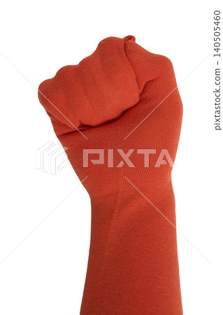 A Strong Orange Fist Raised in Defiance Symbolizing Power, Unity, and Solidarity for Change A Strong Orange Fist Raised in Defiance Symbolizing Power, Unity, and Solidarity for Change 140505460