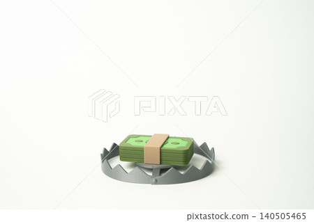 A wad of cash on a trap symbolizing financial fraud and deception. Scam schemes, investment risks, dishonest offers and loss of money. A wad of cash on a trap symbolizing financial fraud and deception. Scam schemes, investment risks, dishonest offers and loss of money. 140505465
