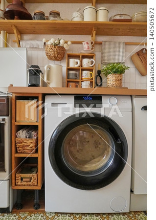 Modern Laundry Room Design Featuring a Stylish Washing Machine and Practical Storage Solutions Modern Laundry Room Design Featuring a Stylish Washing Machine and Practical Storage Solutions 140505672