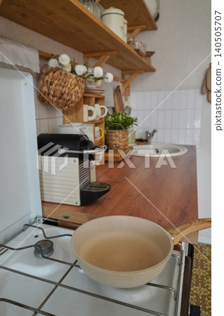 Cozy Kitchen Setting with Natural Elements and Functional Appliances for Culinary Creativity Cozy Kitchen Setting with Natural Elements and Functional Appliances for Culinary Creativity 140505707