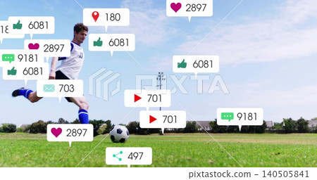 Striking soccer ball, male wearing white kit blue socks on grassy pitch, social bubbles, copy space Striking soccer ball, male wearing white kit blue socks on grassy pitch, social bubbles, copy space 140505841