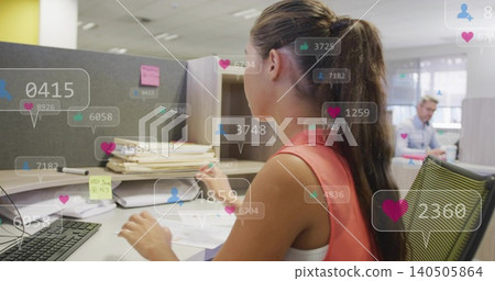 Sorting papers, woman in coral top at office desk using keyboard, with notification overlays Sorting papers, woman in coral top at office desk using keyboard, with notification overlays 140505864