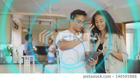 Holding tablet, woman pointing, man gesturing above screen at kitchen island, ear clip, AR overlays Holding tablet, woman pointing, man gesturing above screen at kitchen island, ear clip, AR overlays 140505988