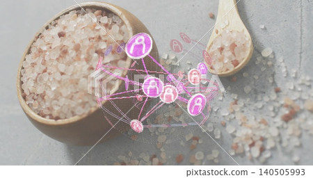 Glowing holographic network hovering over bowl of pink salt on gray countertop, with wooden spoon Glowing holographic network hovering over bowl of pink salt on gray countertop, with wooden spoon 140505993